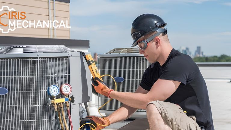 Iris Mechanical technician servicing rooftop HVAC units in the Bay Area.