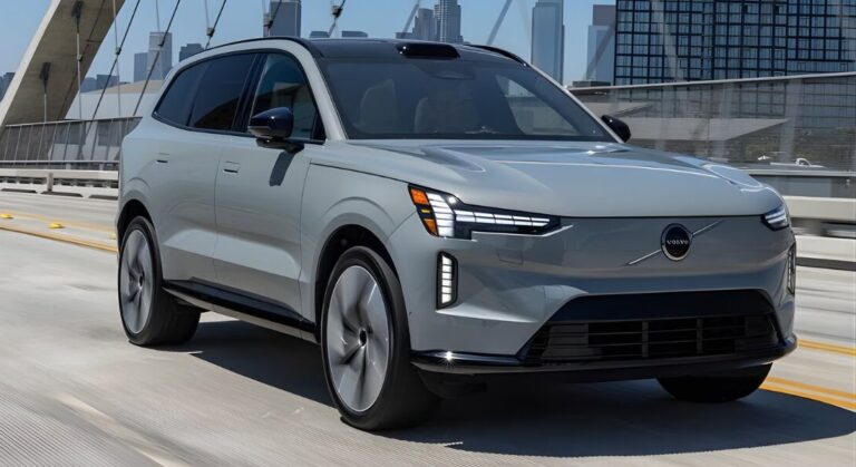 A 2021 Volvo XC40 driving on a highway, showcasing its hybrid, plug-in hybrid, and electric car options.